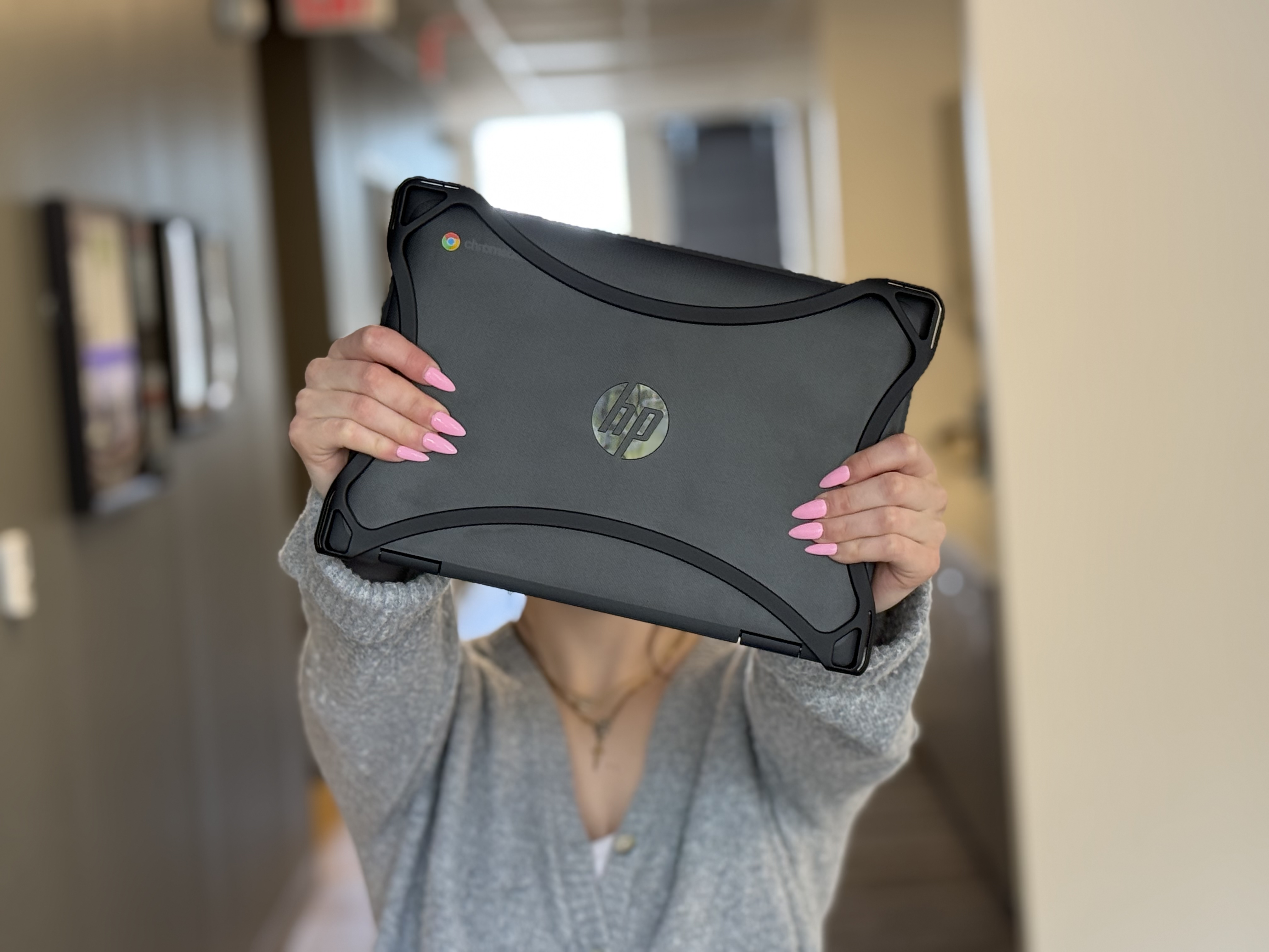 Student holding Rise K12 device case